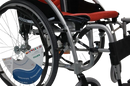Close Up View Of The Frame And Wheels Of The Karman S-Ergo 125 Wheelchair Shown With Red Cushions And Silver Frame