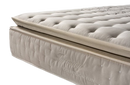 A Close-Up Studio Shot Of The Eurolux Harmony: The 11-Layer Luxury Mattress Crafted By Masters Corner Showing A Tufted Mattress Topper Resting On A Quilted Mattress. The Side Of The Mattress Features The Embossed Brand Name 'Harmony' And 'Coleccion Elite'