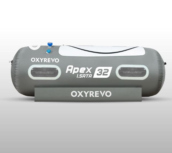A gray OxyRevo Apex32 1.5 ATA Portable Hyperbaric Chamber with multiple windows and branding on the side.