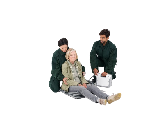 A Man And A Woman In Dark Green Healthcare Uniforms Assist An Elderly Woman Lying On The Winncare Mangar ELK With Airflo 24 