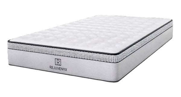A Rejuvenyx Mattress Shown Mattress Shown At A Three-Quarter Angle. The Mattress Features A White Quilted Top, A Textured Gray Side Panel With The Rejuvenyx Brand Logo, And A Black Dotted Border Trim.