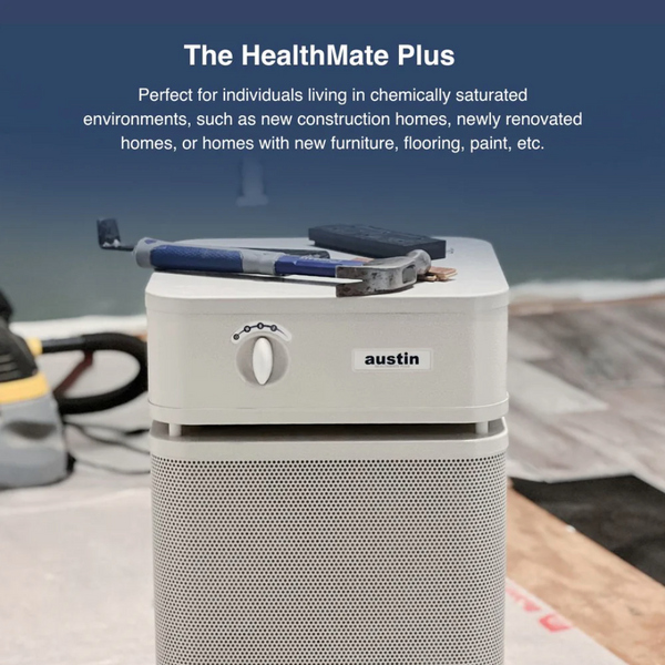 A Sandstone Austin Air Systems HealthMate Plus Standard Air Purifier Shown In A Workshop Setting With Tools Resting On Top, Accompanied By Promotional Text At The Top About The HealthMate Plus