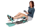 A Woman Using A Kinetec Spectra Essential Knee CPM Machine, Which Is Designed For Knee Rehabilitation. 