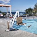 Aqua Creek Ranger 2 Pool Lift Chair By A Pool With Lounge Chairs And A Cabana In The Background. 