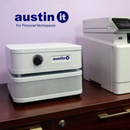 Austin Air Systems "it" Personal Compact Air Purifier On A Dark Wood Desk, With A Printer To The Right