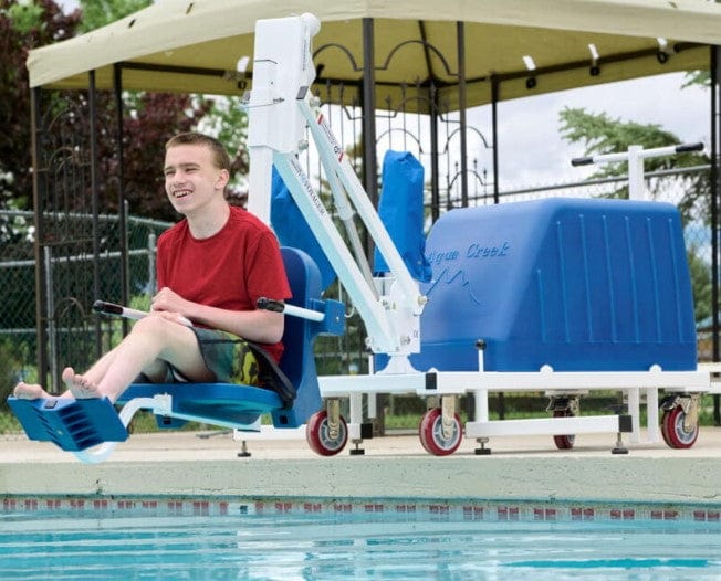 Boy Using The Aqua Creek Voyager Pool Lift Blue Color Side View To Enter A Pool. 