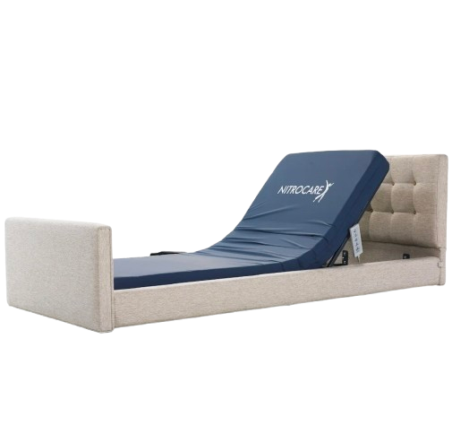Close Up Left Side View Of The Nitrocare Miranda Hi Low Adjustable Bed Shown With The Head Portion Of The Frame In The Fully Raised Position