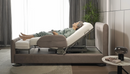 Close Up Left Side View Of The StarSleep Arlo Rotating Bed With An Elderly Woman Lying In The Bed In The Head Elevated Position Shown In A Bedroom Setting