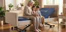 Close Up Right Side View Of An Elderly Woman Reading To Two Children While Sitting On The Nitrocare Miranda Hi Low Adjustable Bed In A Bedroom Setting