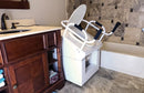 Close Up Right Side View Of The Throne Buttler Powered Toilet Lift Chair With Base Bidet Seat TLFE003 Shown In The Raised Position Over A White Toilet Bowl In A Bathroom Setting