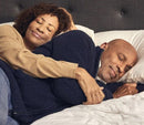 Close Up View Of A Couple Lying In Bed Together On The Luxury Dawn House Foam Mattress
