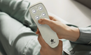 Close Up View Of A Hand Operating The Controls For The StarSleep Arlo Rotating Bed