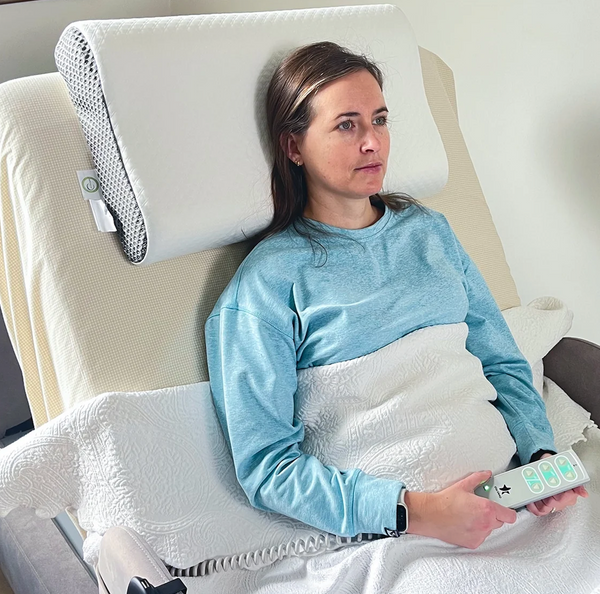 Close Up View Of A Woman Lying On The StarSleep Premium Memory Foam Pillow While Using The StarSleep Arlo Rotating Bed