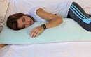 Close Up View Of A Woman Wearing Fitness Clothing Lying On The Standard Body Eurolux Green Planet Pillow On A Mattress
