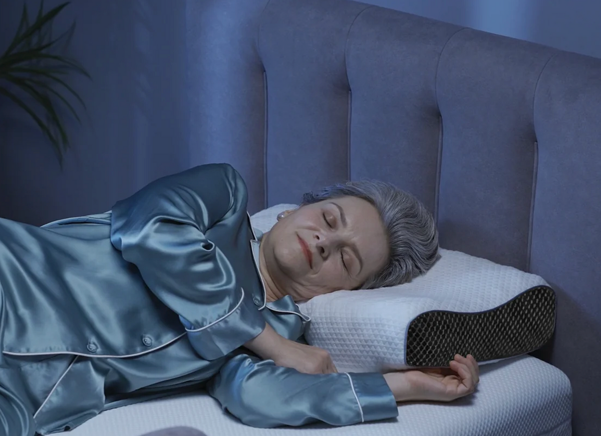 Close Up View Of An Elderly Woman Sleeping Peacefully On The StarSleep Premium Memory Foam Pillow