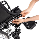 Close Up View Of Human Arms Adjusting The Seat Depth Of The Dynarex DynaRide S5 Ultra Lite Wheelchair