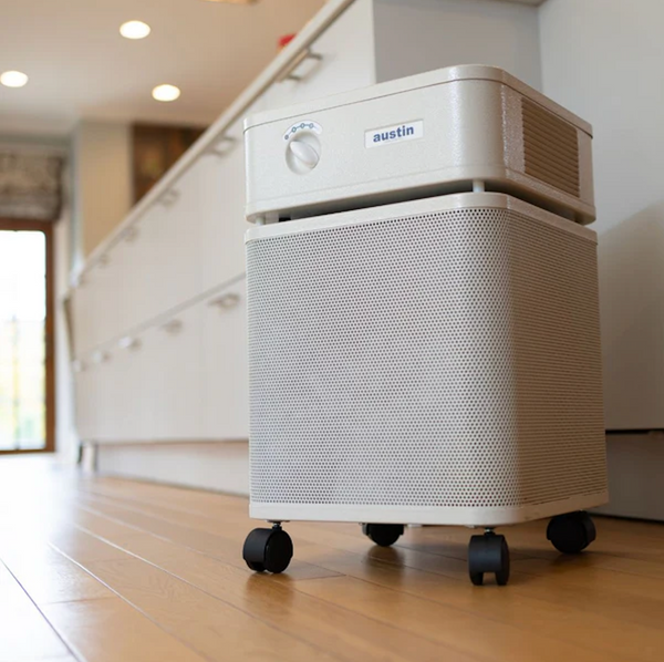 Close Up View Of The Austin Air Systems HealthMate Standard Air Purifier In Sandstone Color, Shown In A Modern Home Interior On A Wooden Floor