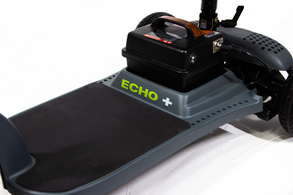 Close Up View Of The Battery Compartment And The Footrest Platform Of The Shoprider Echo Plus: Lightweight 3-Wheel Mobility Scooter