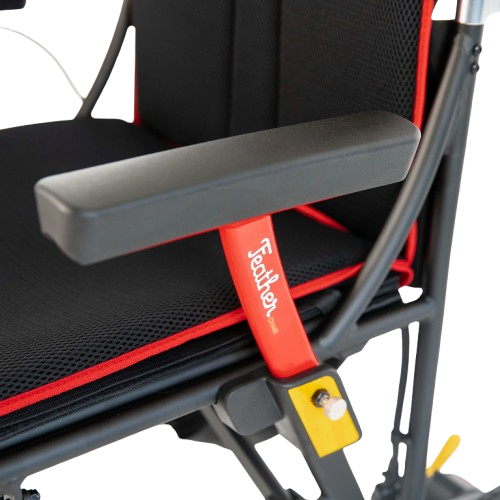 Close Up View Of The Feather Electric Wheelchair Armrest With Feather Logo Displayed 
