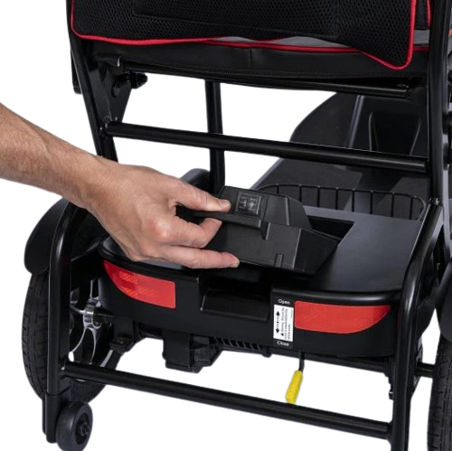 Close Up View Of Feather Mobility Scooter Removeable Battery Shown With Hand Removing Battery