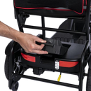 Close Up View Of Feather Mobility Scooter Removeable Battery Shown With Hand Removing Battery