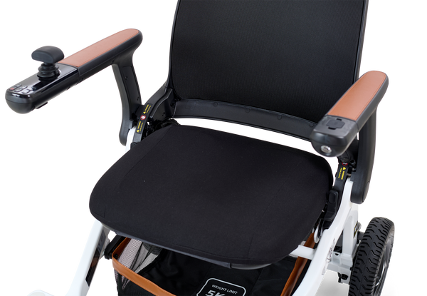 Close Up View Of The Golden Technologies Ally Electric Wheelchair Seat And Armrests Shown In White Color