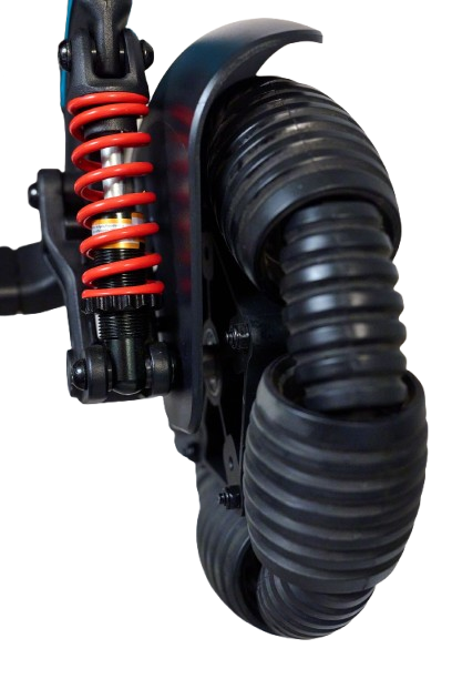 Close Up View Of The Golden Technologies Ally Pro Omnidirectional Electric Wheelchair Omnidirectional Wheel And Suspension