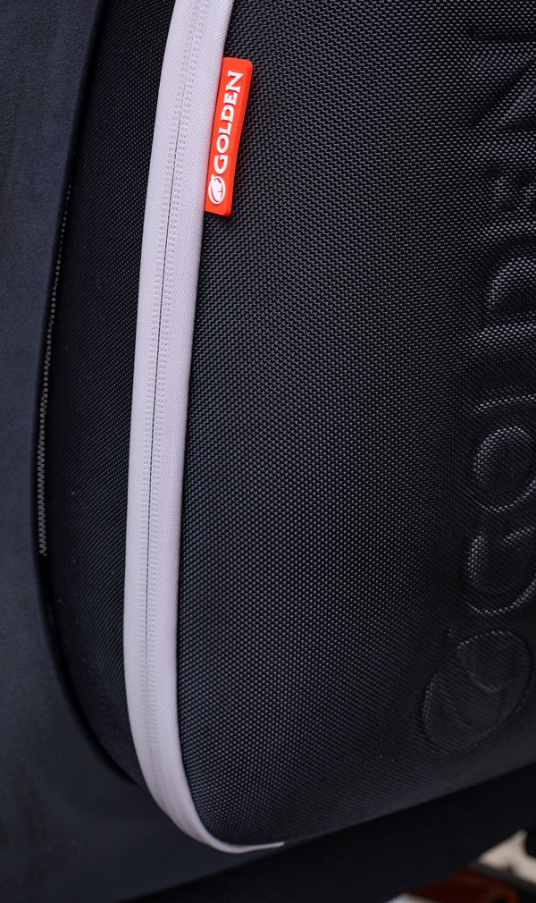 Close Up View Of The Golden Technologies Ally Pro Omnidirectional Electric Wheelchair Rear Storage Compartment Zipper And Golden Logo Branding