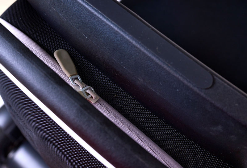 Close Up View Of The Golden Technologies Ally Pro Omnidirectional Electric Wheelchair Rear Storage Compartment Zipper