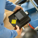 Close Up View Of The Journey So Lite Mobility Scooter Battery Shown With Elderly Woman Holding Battery