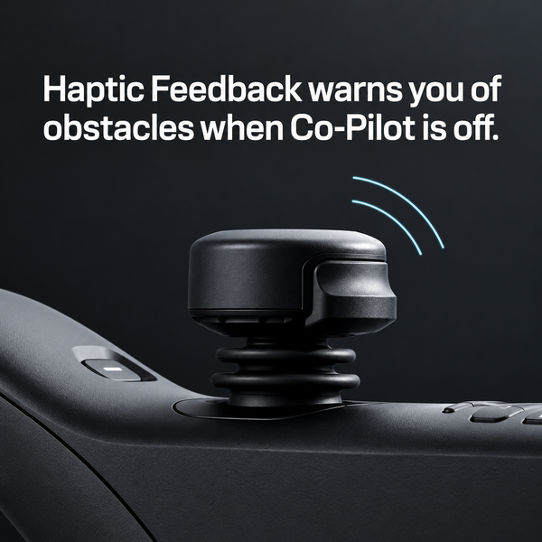 Close Up View Of The Joystick Of The STRUTT ev1 Smart Electric Mobility Vehicle Highlighting Its Haptic Feedback Feature With Text Haptic Feedback Warns You Of Obstacles When Co-Pilot Is Off