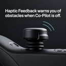 Close Up View Of The Joystick Of The STRUTT ev1 Smart Electric Mobility Vehicle Highlighting Its Haptic Feedback Feature With Text Haptic Feedback Warns You Of Obstacles When Co-Pilot Is Off
