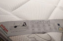 Close Up View Of The Marketing Tag For The Eurolux Quietud: The 9-Layer Luxury Mattress Crafted By Masters Highlighting Its Features