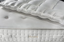 Close Up View Of The Mattress Topper For The Eurolux Natur: The 6-Layer Luxury Mattress Crafted By Masters With The Natura Text Seen On The Side Of The Mattress
