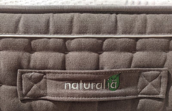 Close Up View Of The Naturalia Text On The Side Of The Eurolux Quietud: The 9-Layer Luxury Mattress Crafted By Masters