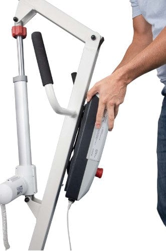 Close Up View Of The Removable Battery For The Vive Health Electric Patient Lift Shown With A Person Removing The Battery