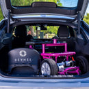 Close Up View Of The Reyhee EXO Electric Mobility Scooter Shown In The Purple Color Inside The Trunk Of A Compact Car