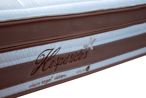 Close Up View Of The Side Of The Eurolux Lux By Naturalia: The 6-Layer Luxury Mattress Crafted By Masters With Luxury Text Written