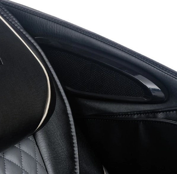 Close Up View Of The Side Speaker For The Kyota Kizuna M688 Massage Chair Shown In Black Color
