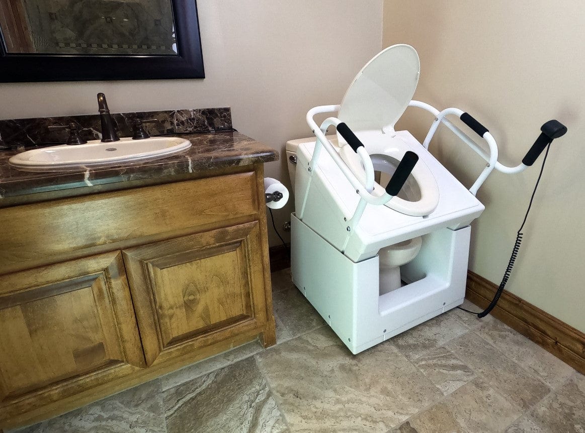 Close Up View Of The Throne Buttler Powered Toilet Lift Chair TLFE001 Shown In The Raised Position Over A White Toilet Bowl In A Bathroom Setting