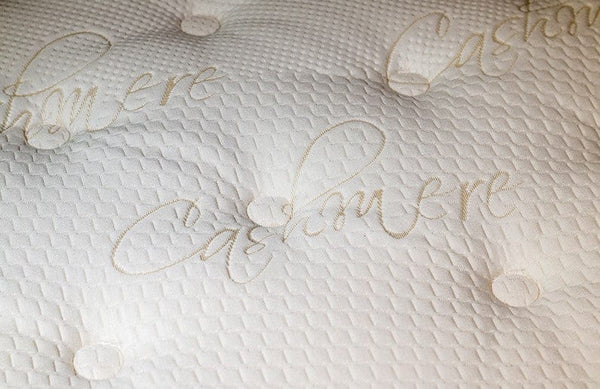 Close Up View Of The Top Of The Eurolux Lux By Naturalia: The 6-Layer Luxury Mattress Crafted By Masters With Cashmere Text Written On The Mattress