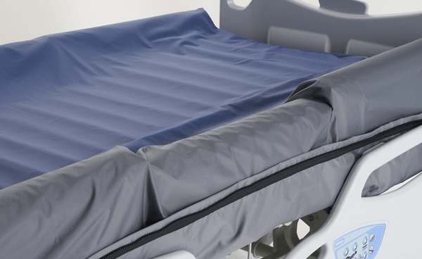 Close Up View Of The Top Of The Wellell Optima Turn Lateral Rotation Pressure Relief Mattress With Stretch Cover