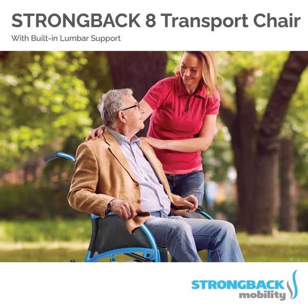 Elderly Man Sitting In The Strongback Excursion 8 Lightweight Transport Chair With A Woman Standing Over Him Shown In An Outdoor Setting