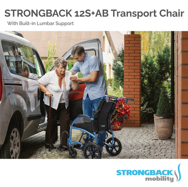 Elderly Woman Exiting Car Into The Strongback Excursion 12S +AB Lightweight Transport Chair With The Help Of A Caregiver In A Home Setting