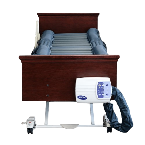 Front Centered View Of A Hospital Bed Shown With The Joerns DermaFloat APL Alternating Pressure Low Air Loss Therapy Mattress System On The Frame With Control Unit Hanging Off The Footboard Panel