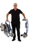 Front Centered View Of An Elderly Man Holding Two Pieces Of The Tzora Feather Ultra Lightweight Mobility Scooter Shown In The Blue Color