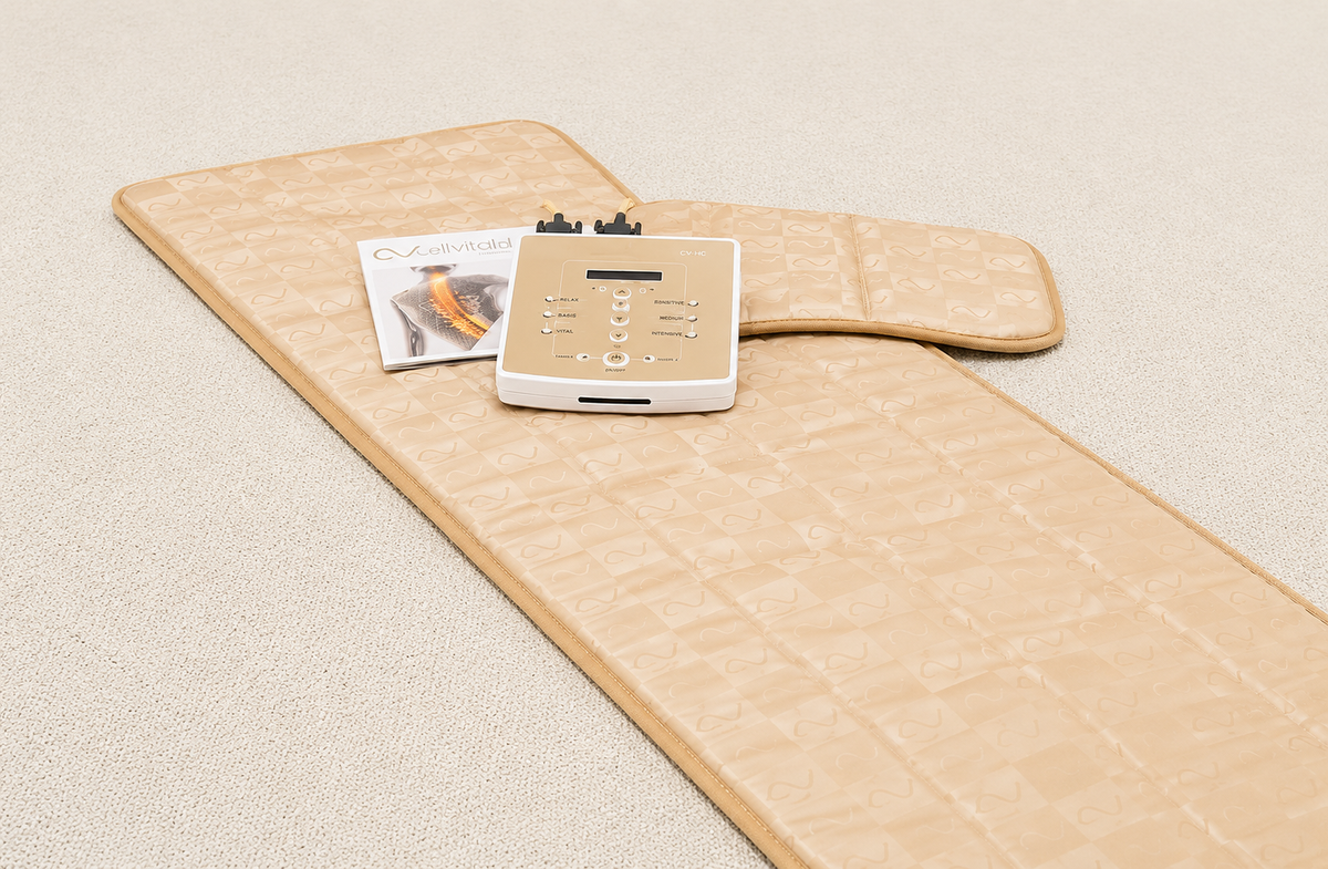 Front Centered View Of The Cellvital Homecare CV-HC PEMF Therapy System Including The Control Unit, User Manual And Pillow Shown On A Carpeted Floor