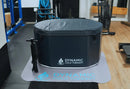 Front Centered View Of The Dynamic Oval Inflatable Cold Plunge Shown With Cover In A Gym Setting