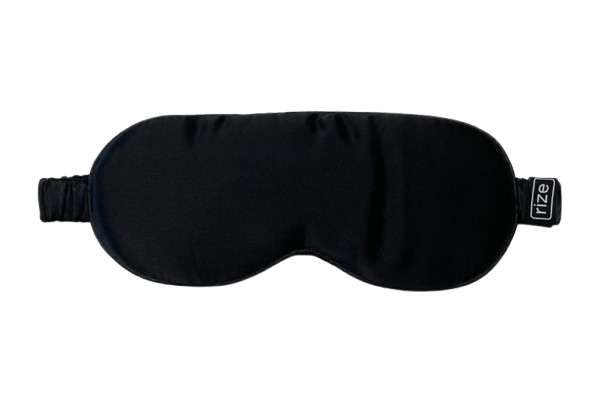 Front Centered View Of The Rize Home Silk Sleep Mask With 'Rize' Branding