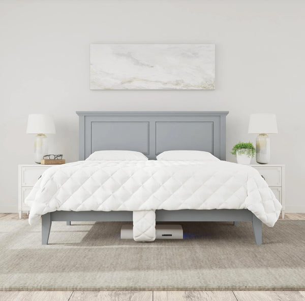 Front Centered View Of The Rize Home Smart Duvet With Blue Light Color On Gray Bedframe Shown In Bedroom Setting With White Walls And Nightstands 